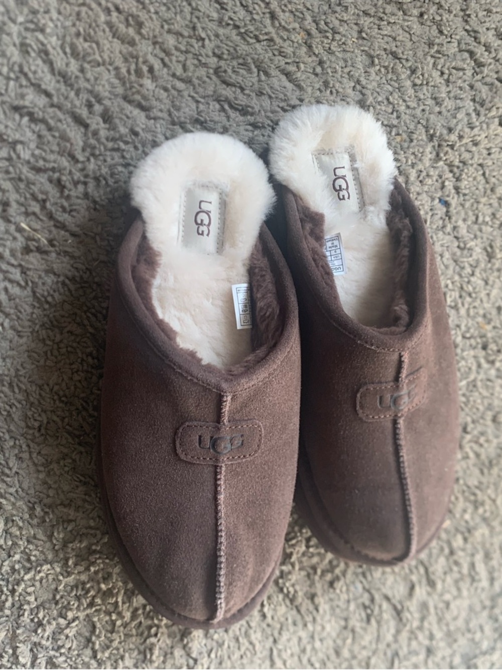 UGG women’s Chestnut Brown Suede Shearling Slip-On Slippers.
